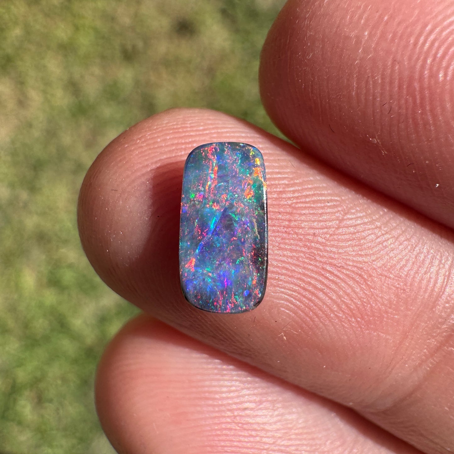 0.55 Ct extra small red and pink boulder opal