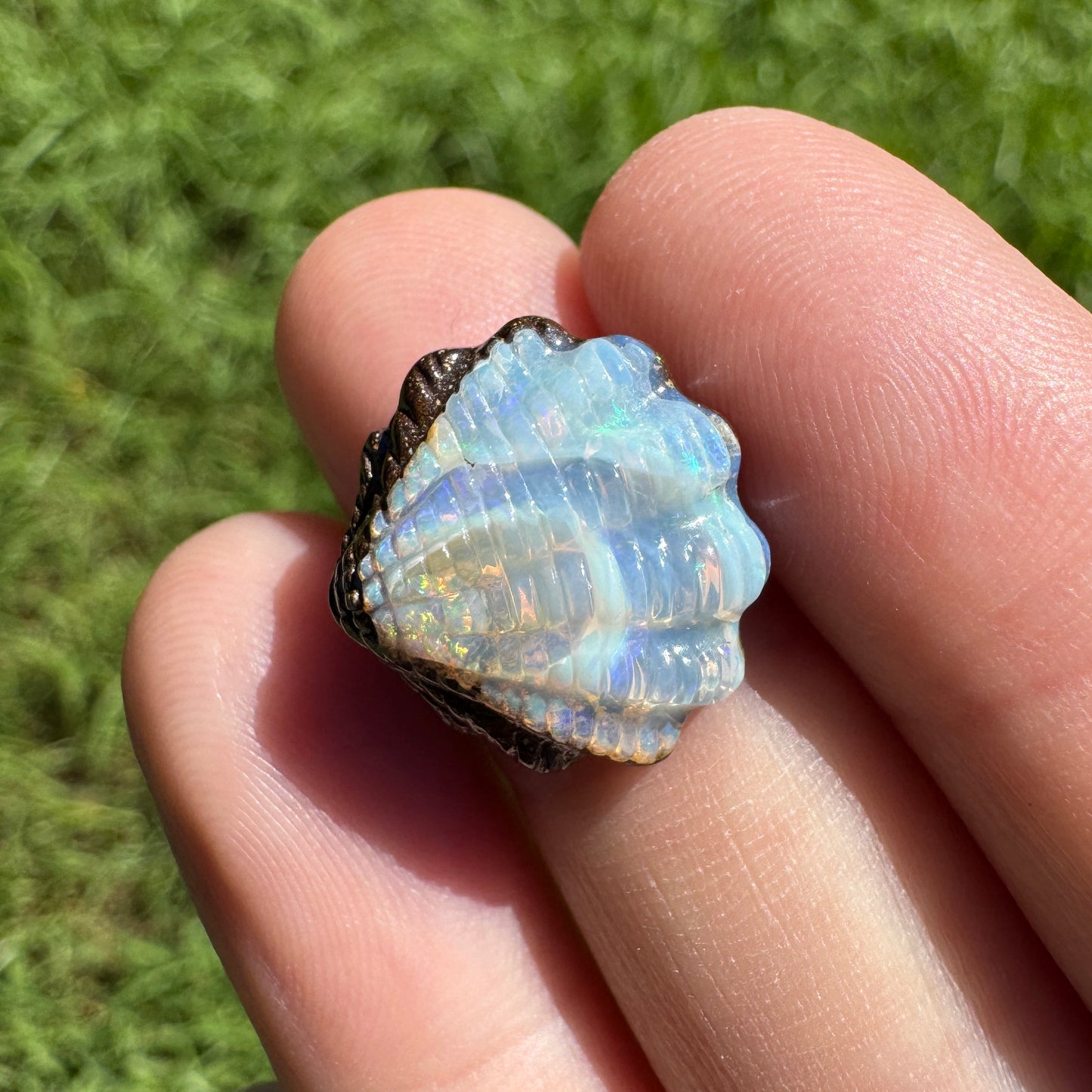 8.88 Ct fan shell boulder opal carving