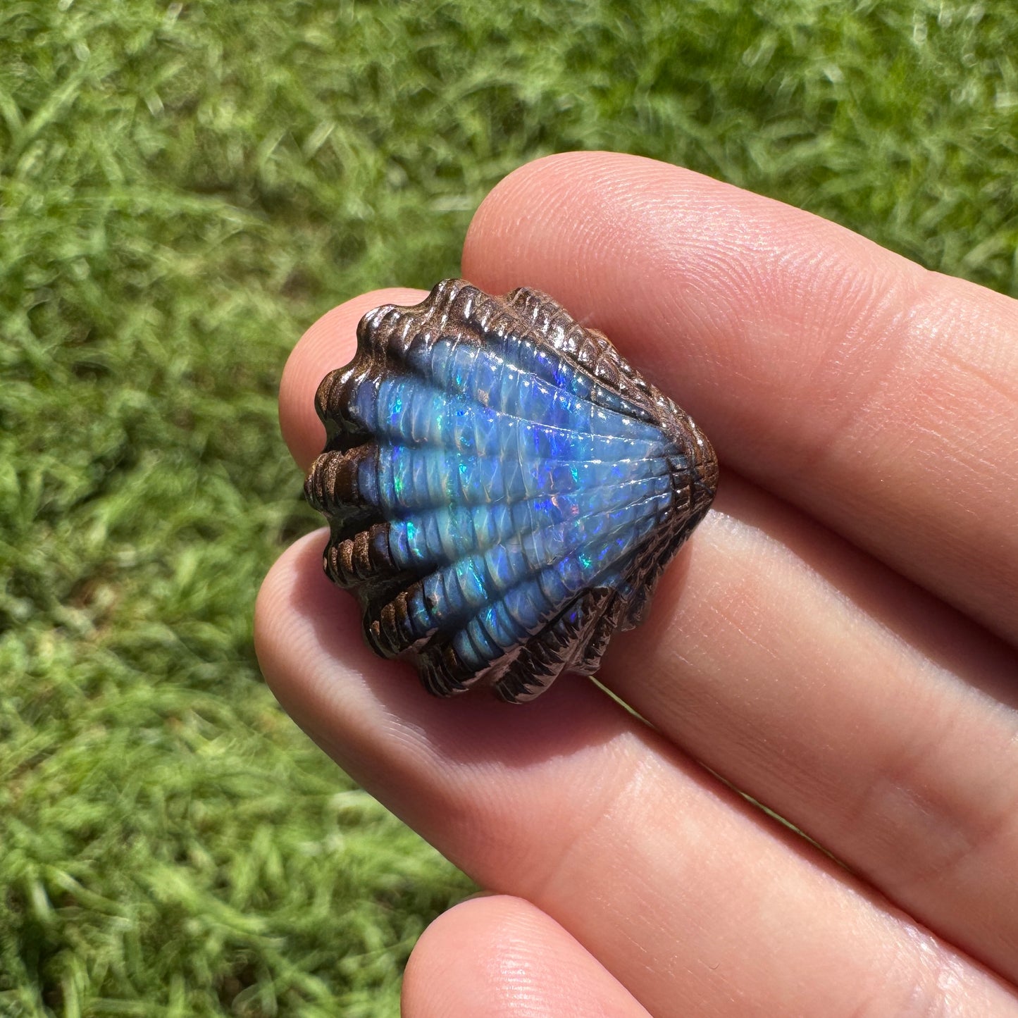 23.75 Ct fan shell boulder opal carving