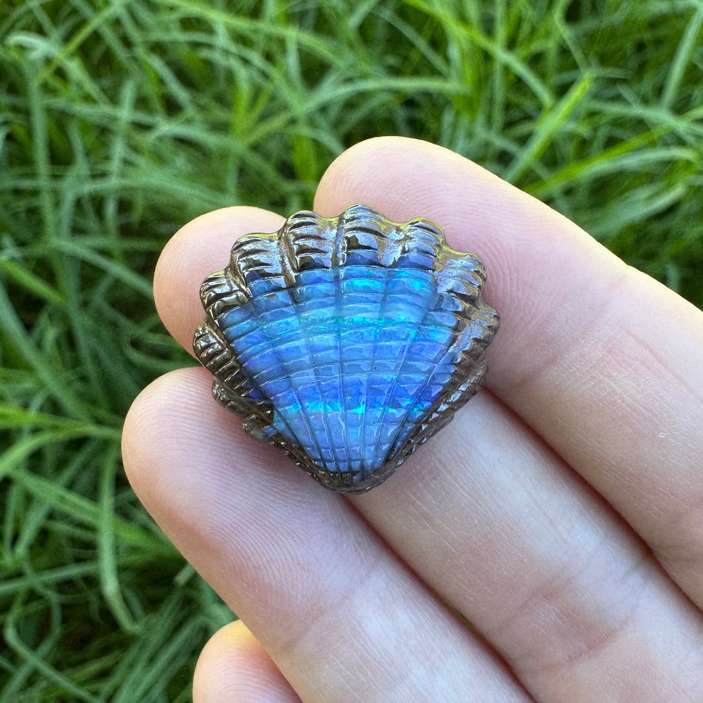 23.75 Ct fan shell boulder opal carving