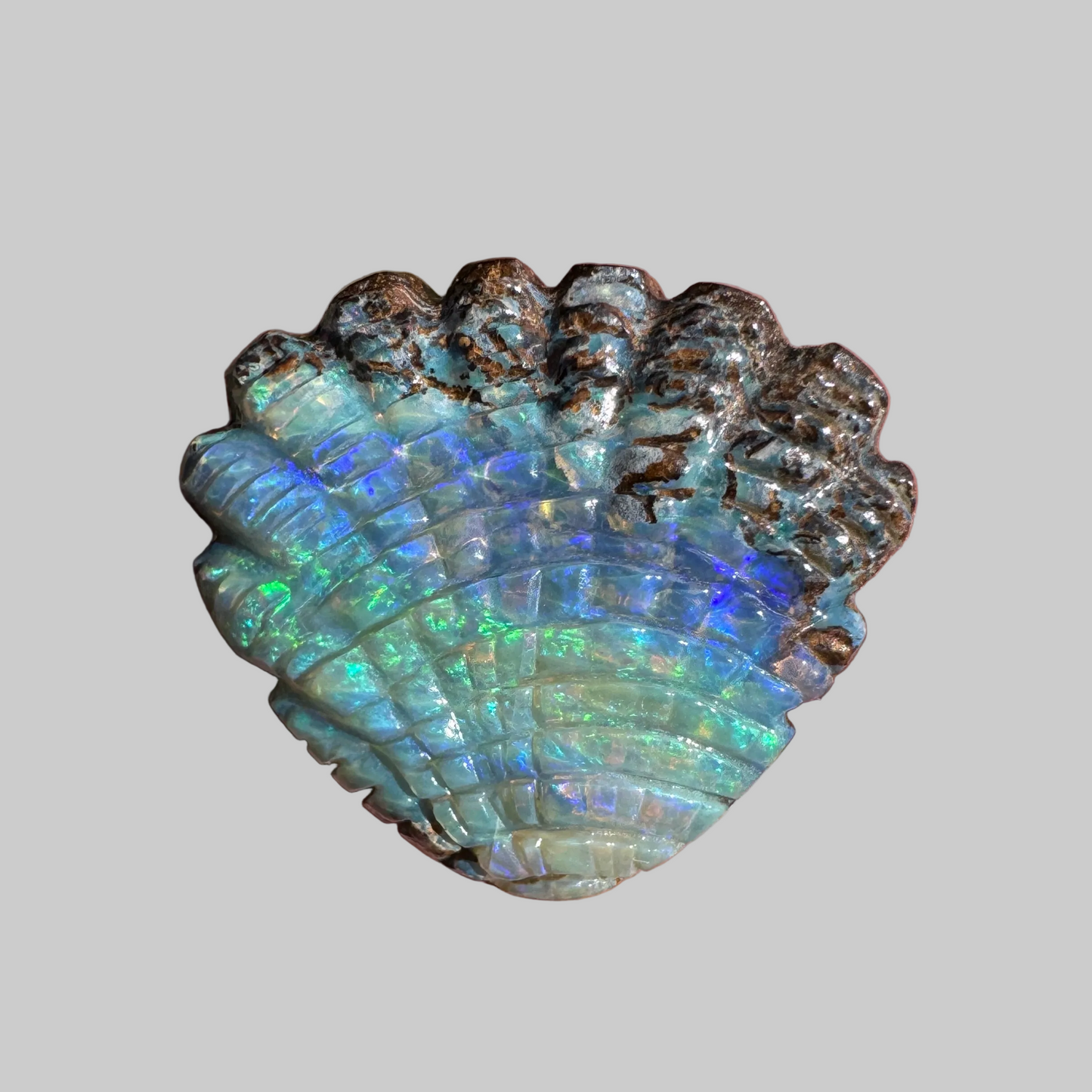9.55 Ct shell boulder opal carving