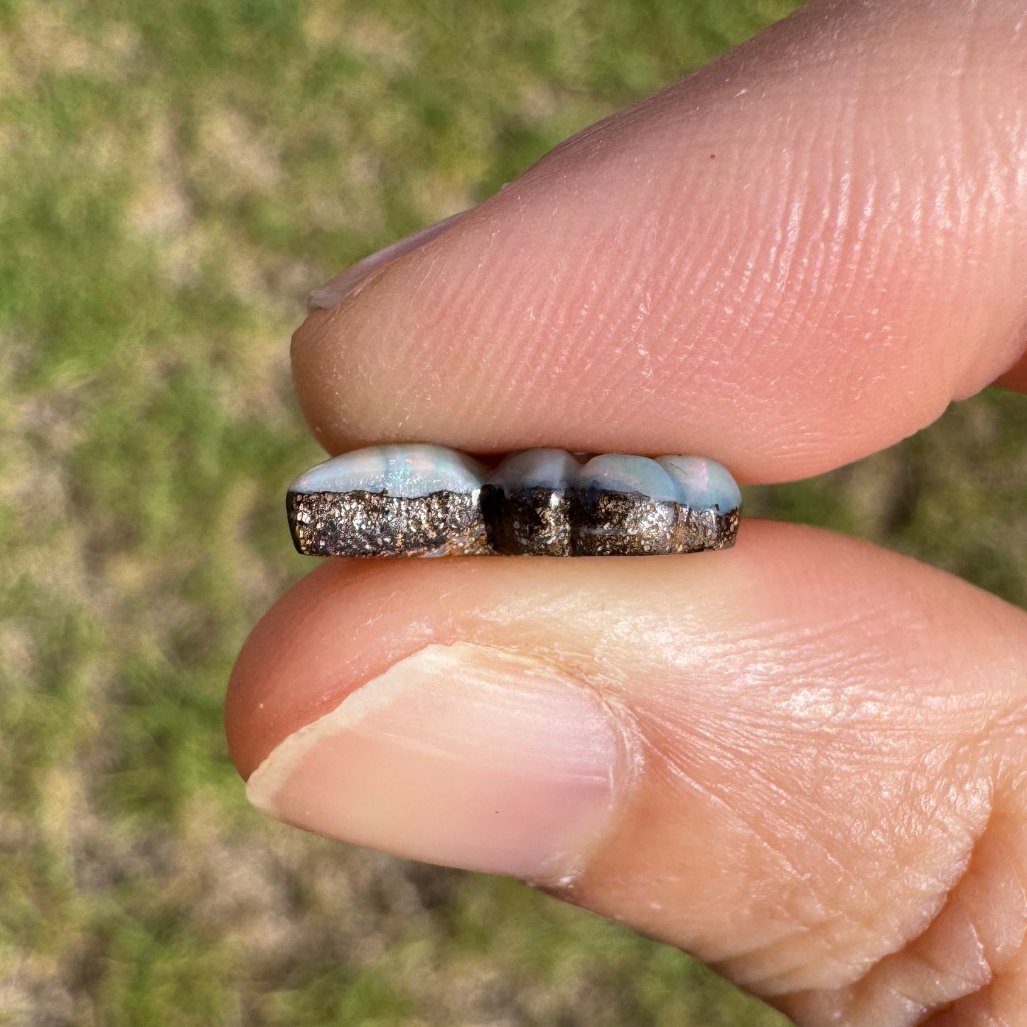 2.99 Ct spiral shell boulder opal carving