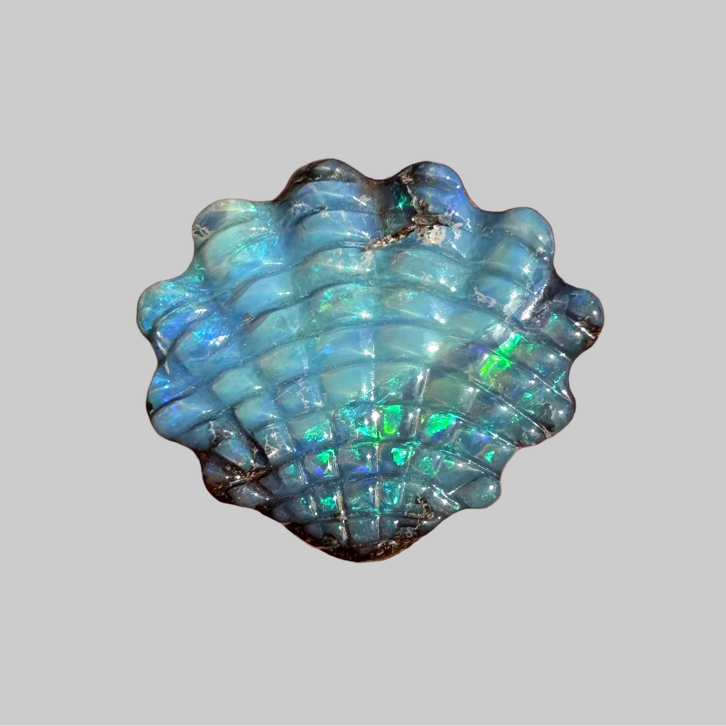 5.52 Ct shell boulder opal carving