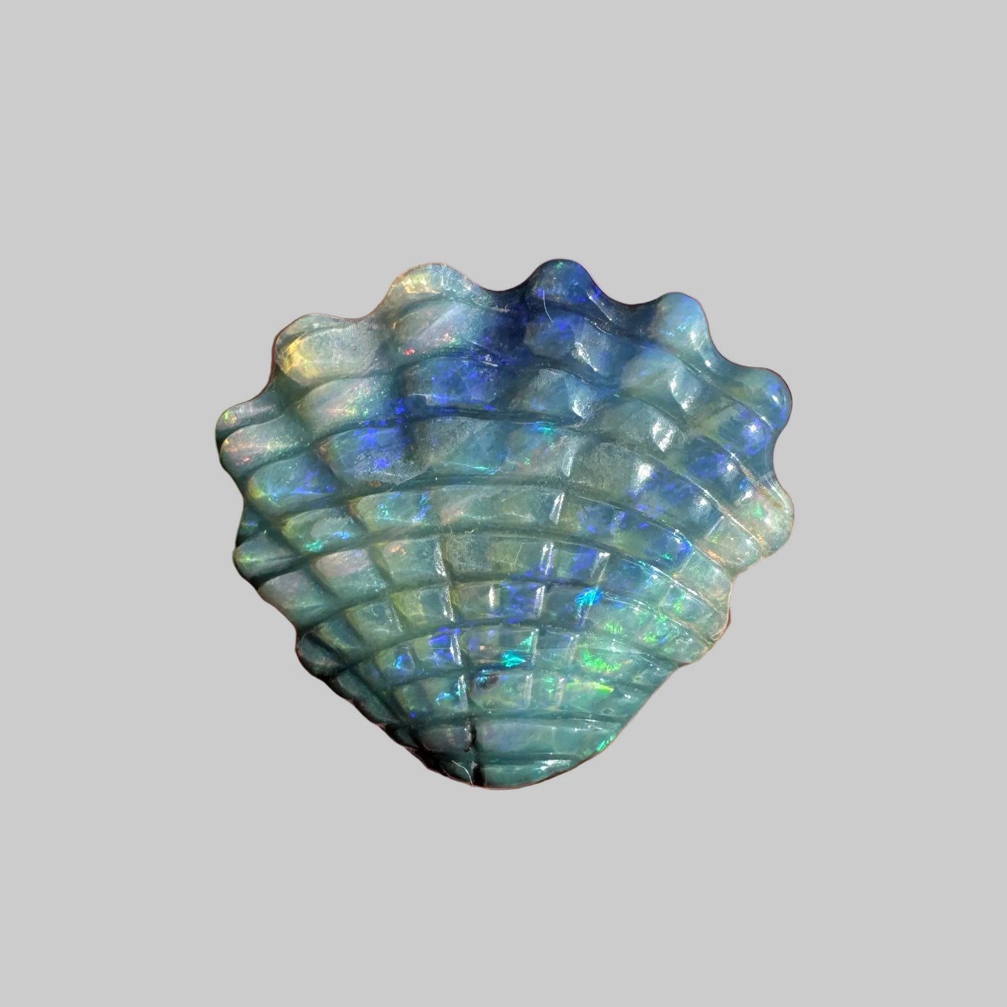 4.74 Ct shell boulder opal carving