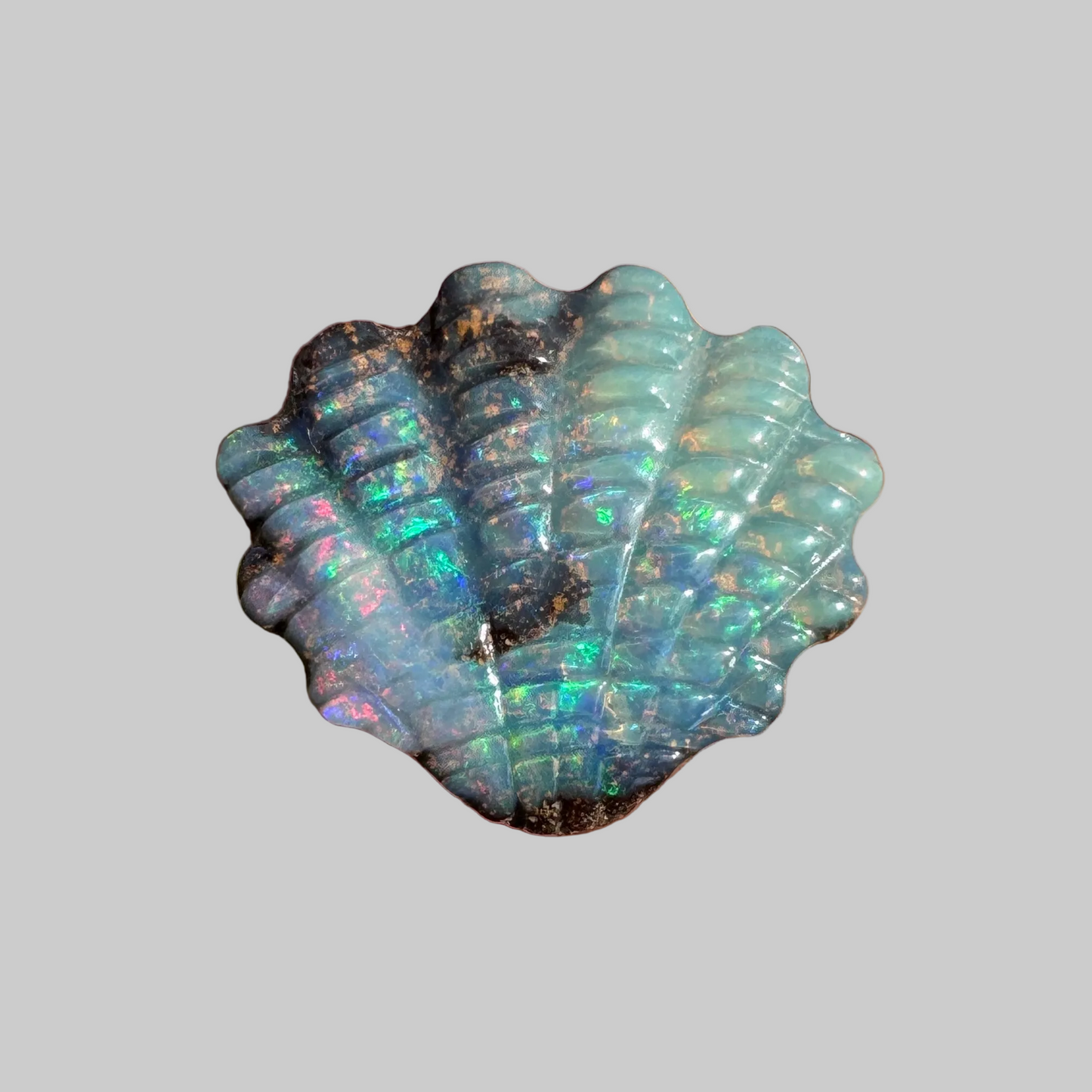 4.75 Ct shell boulder opal carving