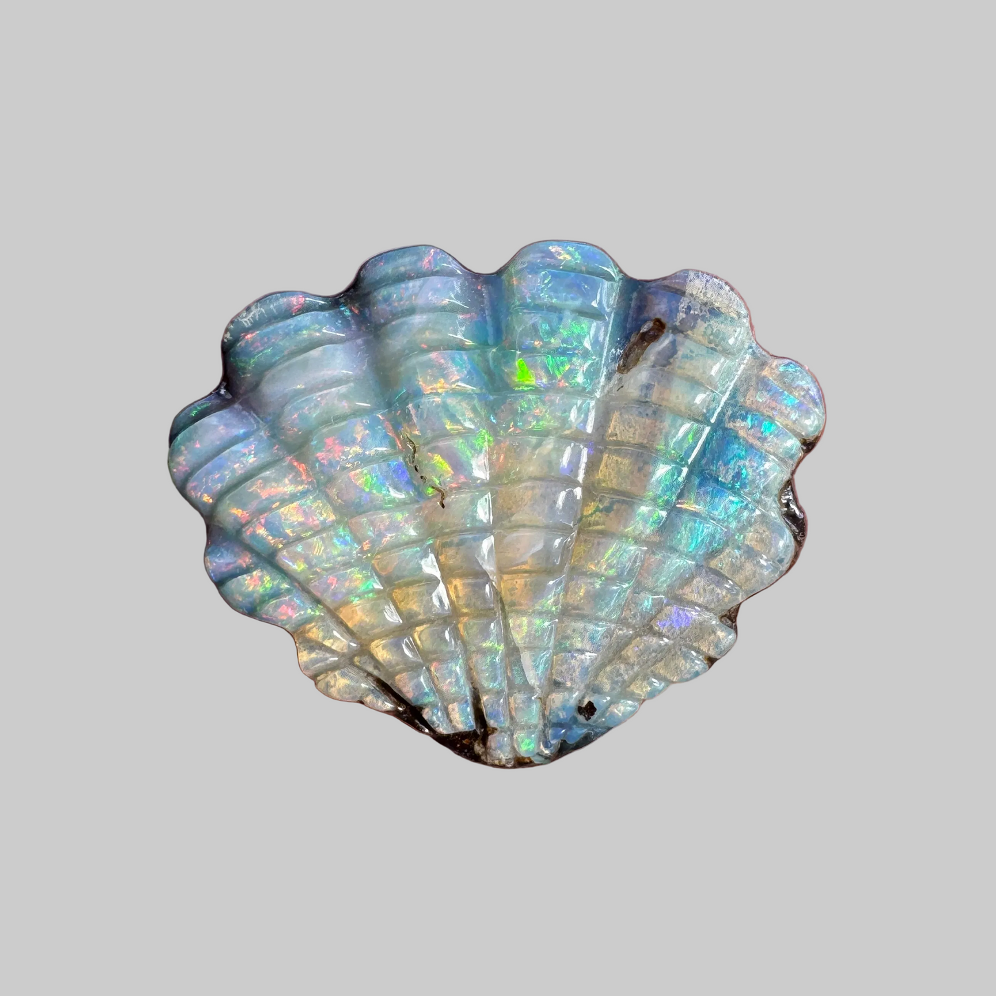 16.97 Ct shell boulder opal carving