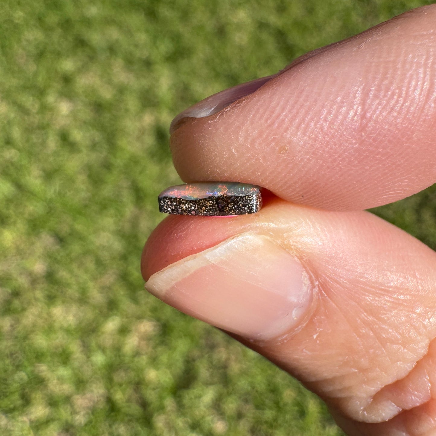 0.78 Ct extra small rainbow boulder opal
