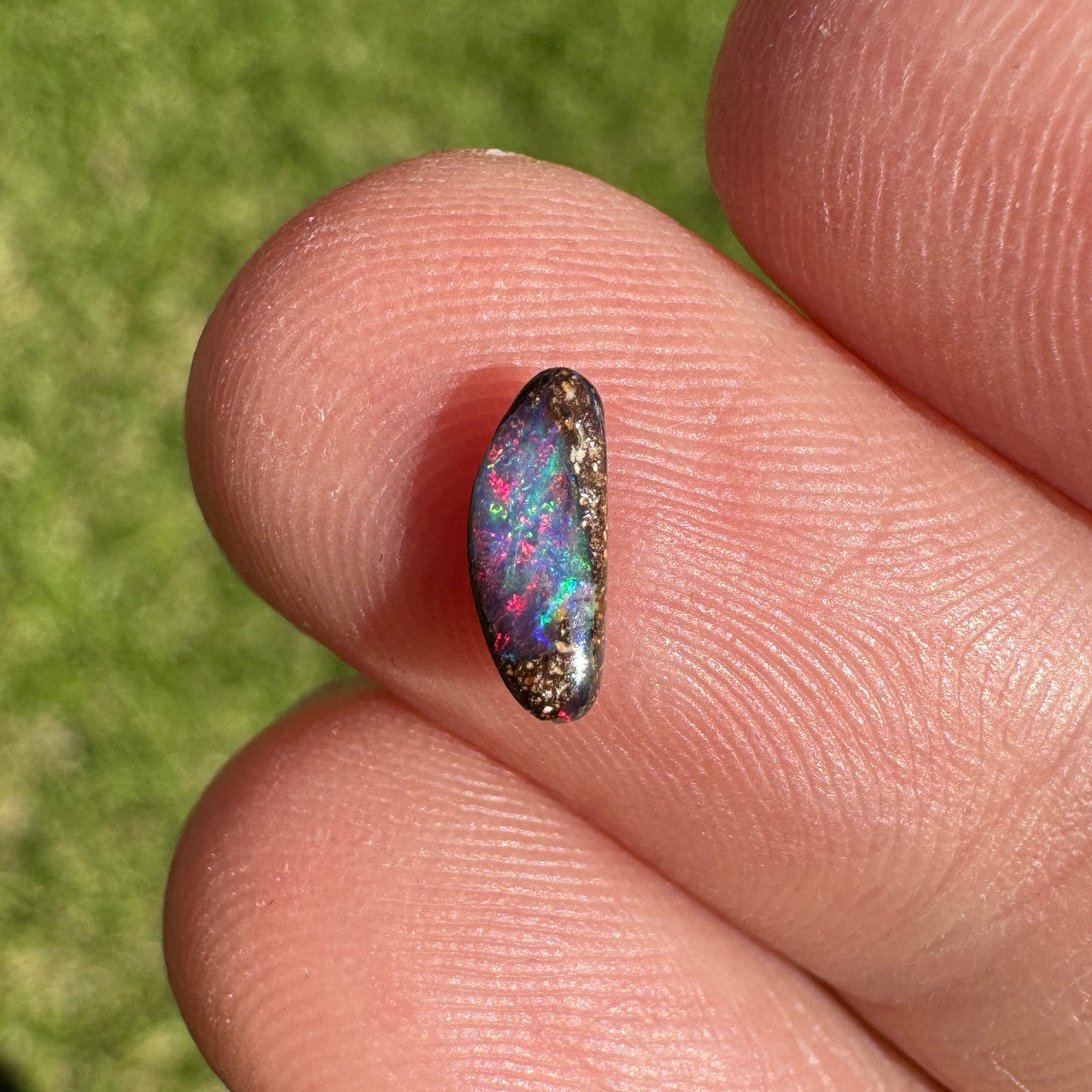 0.31 Ct extra small red boulder opal