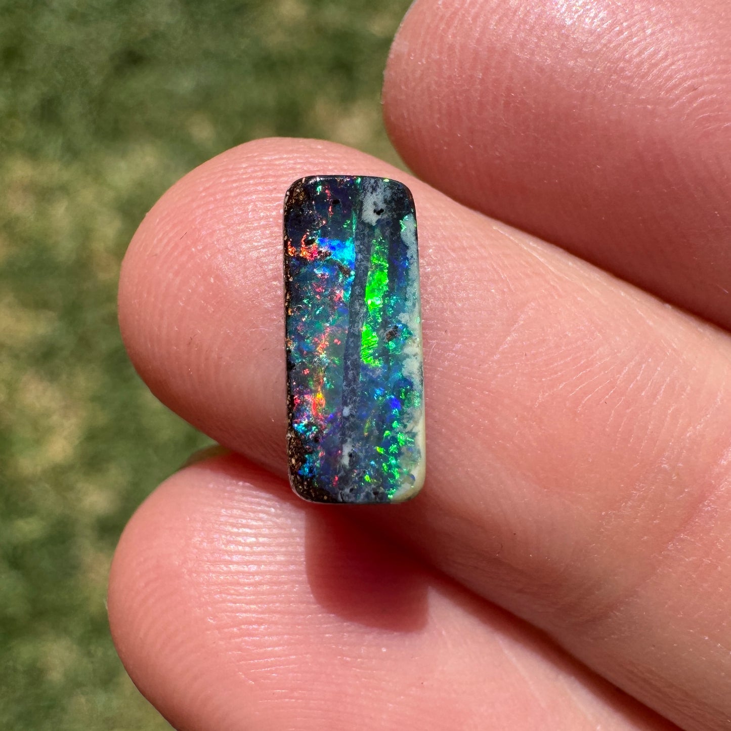 1.31 Ct red and green black gem boulder opal