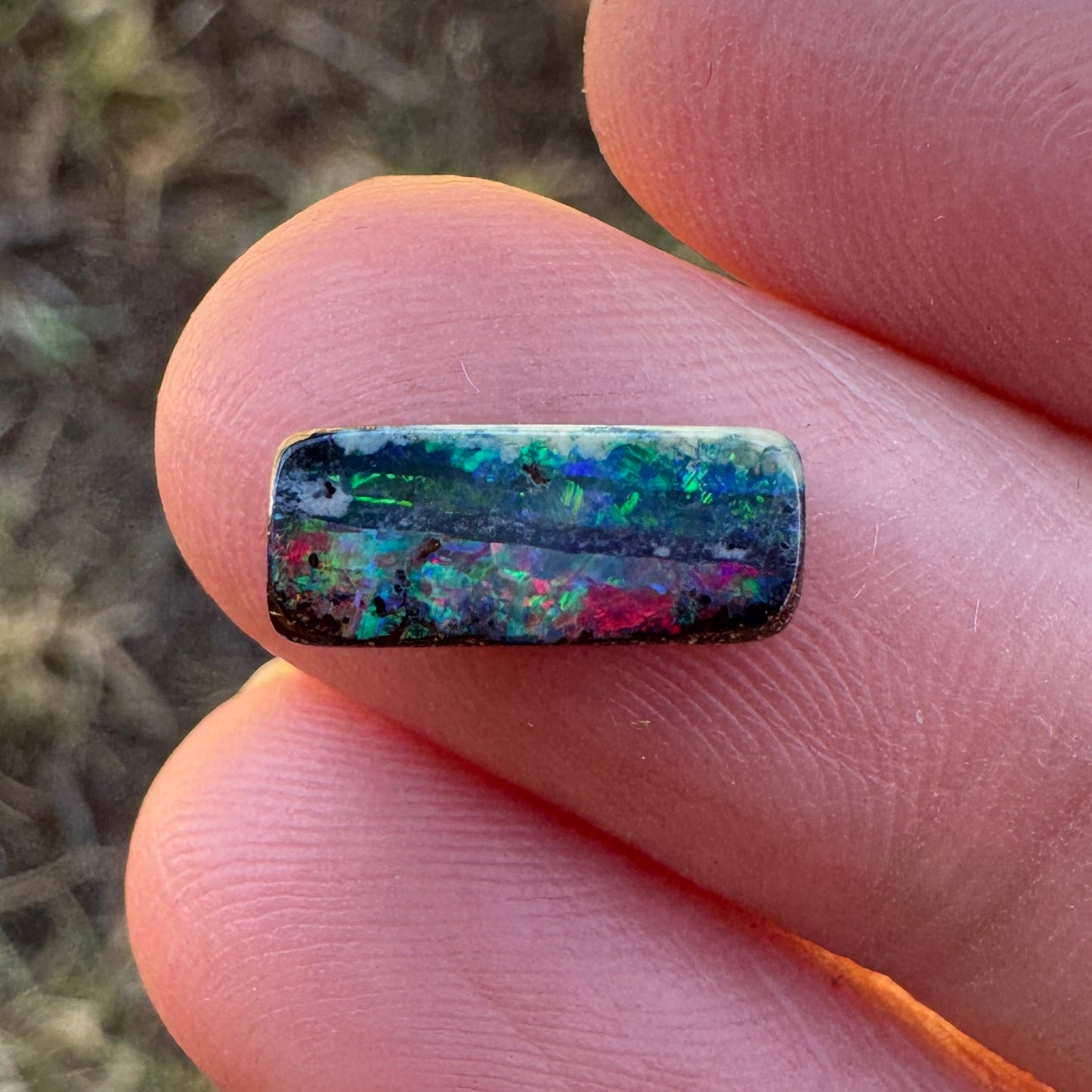 1.31 Ct red and green black gem boulder opal